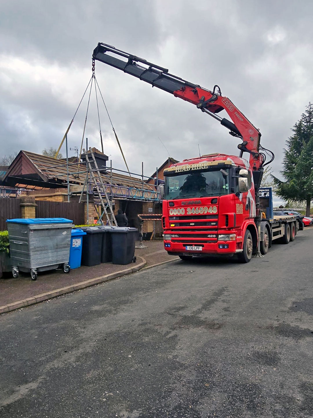 Fassi Crane Lifting a Building Roof in Hertfordshire