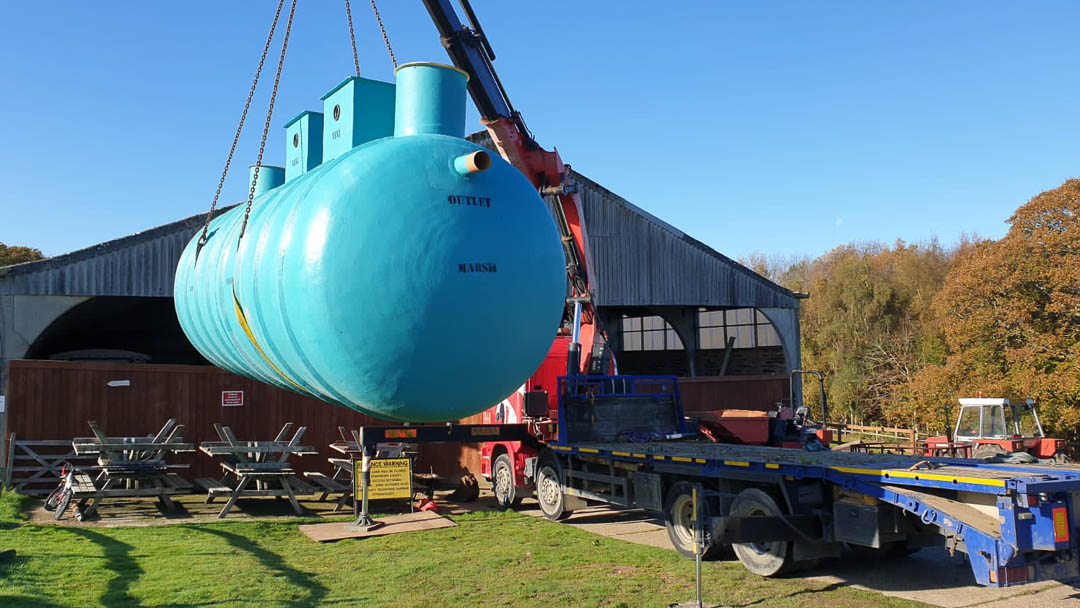 Brighton septic tank lifted by Scania 4 series with 660 crane