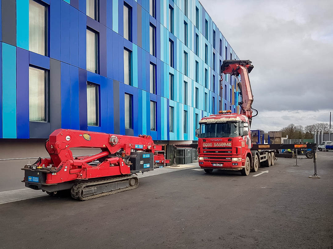 Lowering a scissor lift into duct at Heathrow Airport