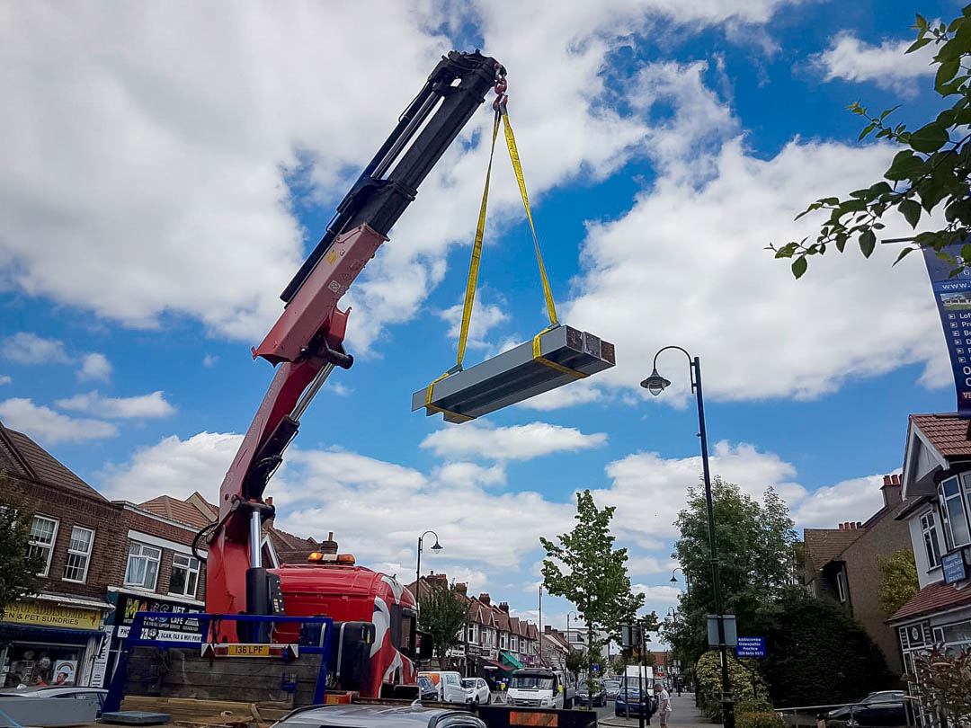 Raising loft conversion RSJs up to roof in Dartford